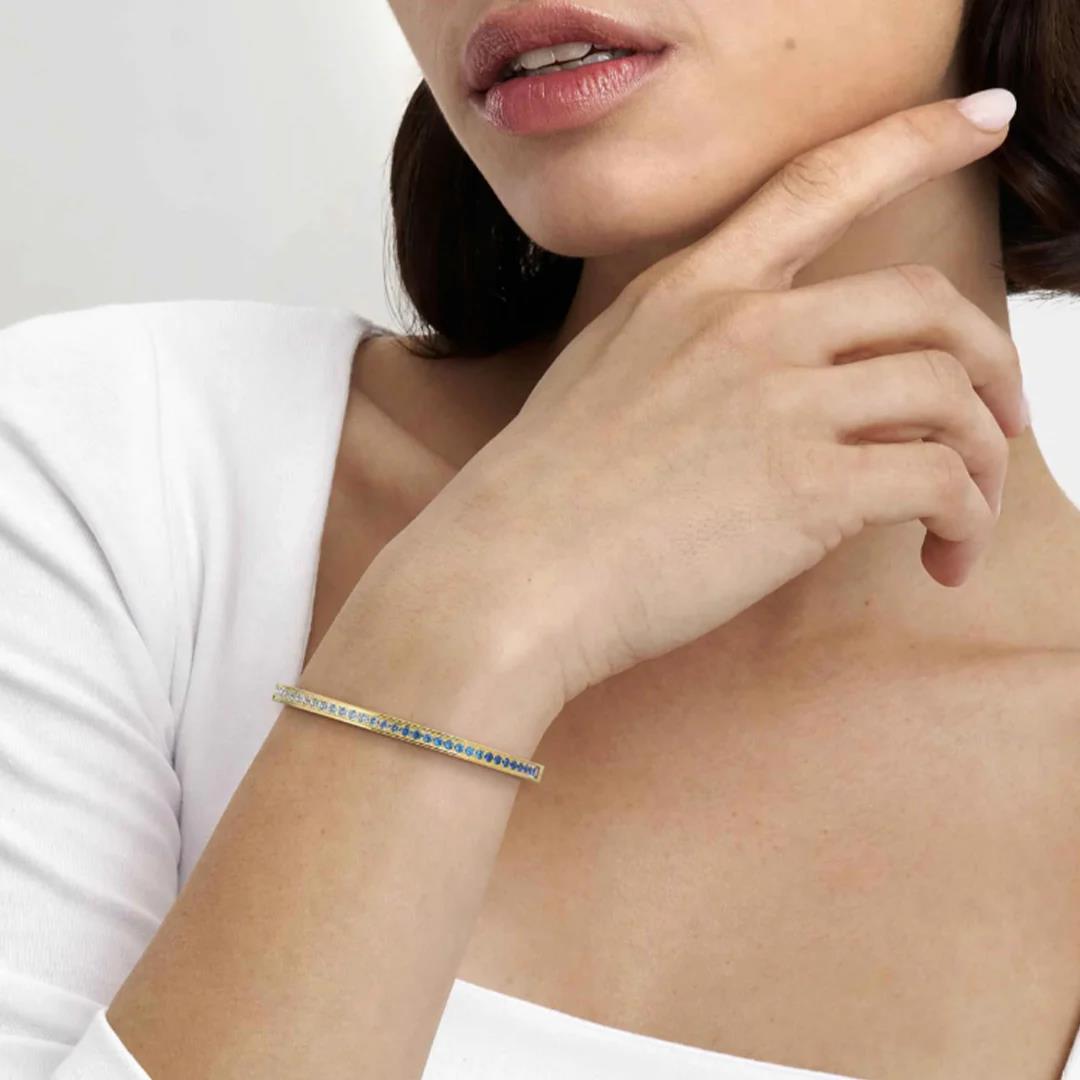 Pretty Bangle In YG With Light Blue CZ