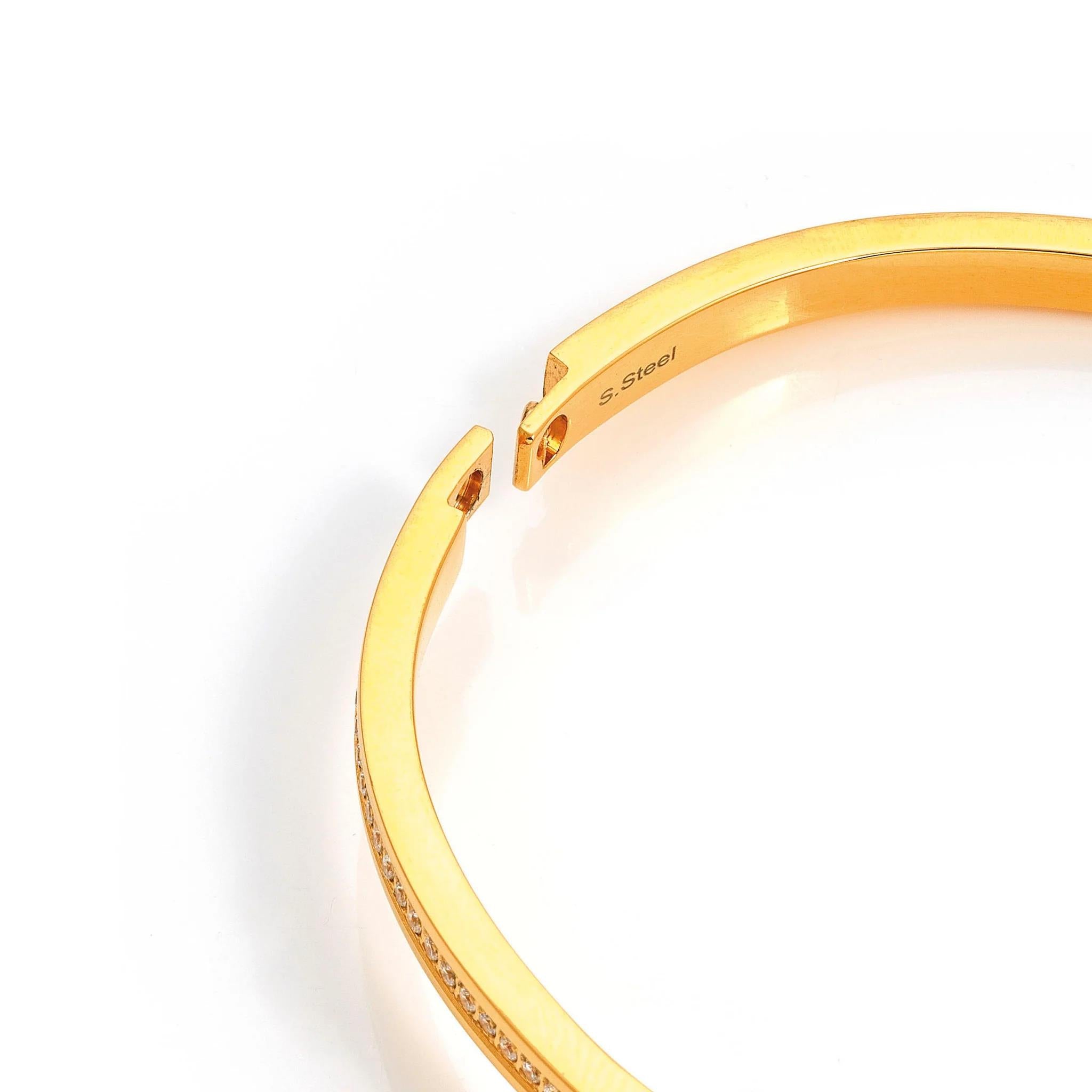 Pretty Bangle In YG With Light Blue CZ